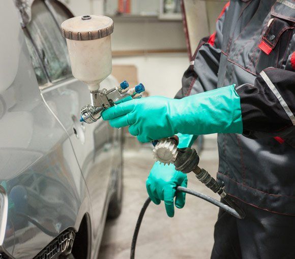Spray Gun with Paint for Painting a Car — Powder coating service in Singleton, NSW