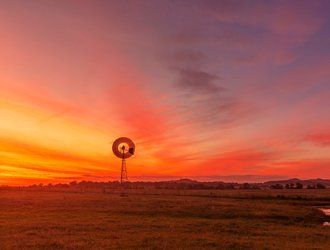Open Field with Wind Mill — Powder coating service in Tomago, NSW