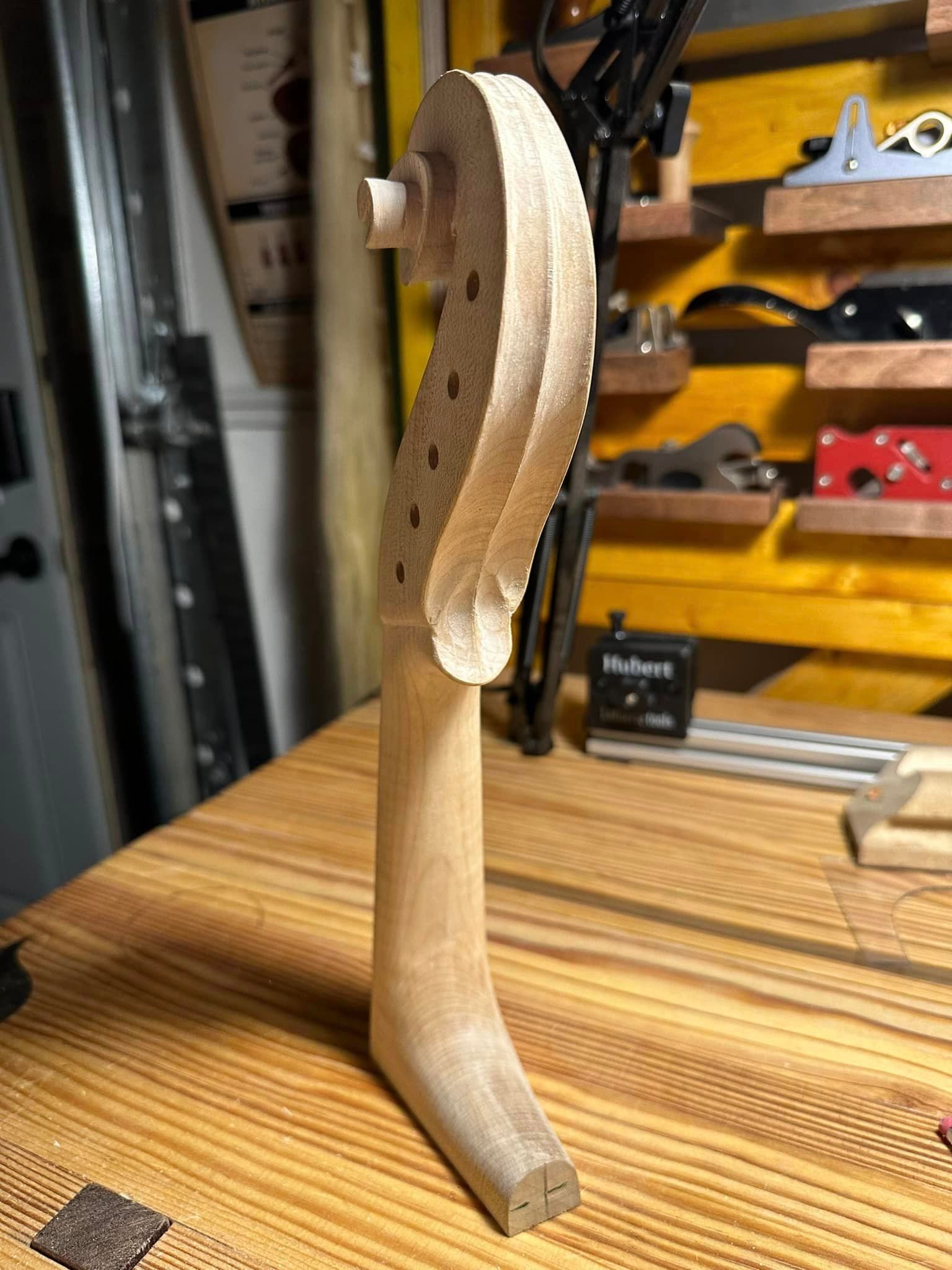 A piece of wood is sitting on top of a wooden table