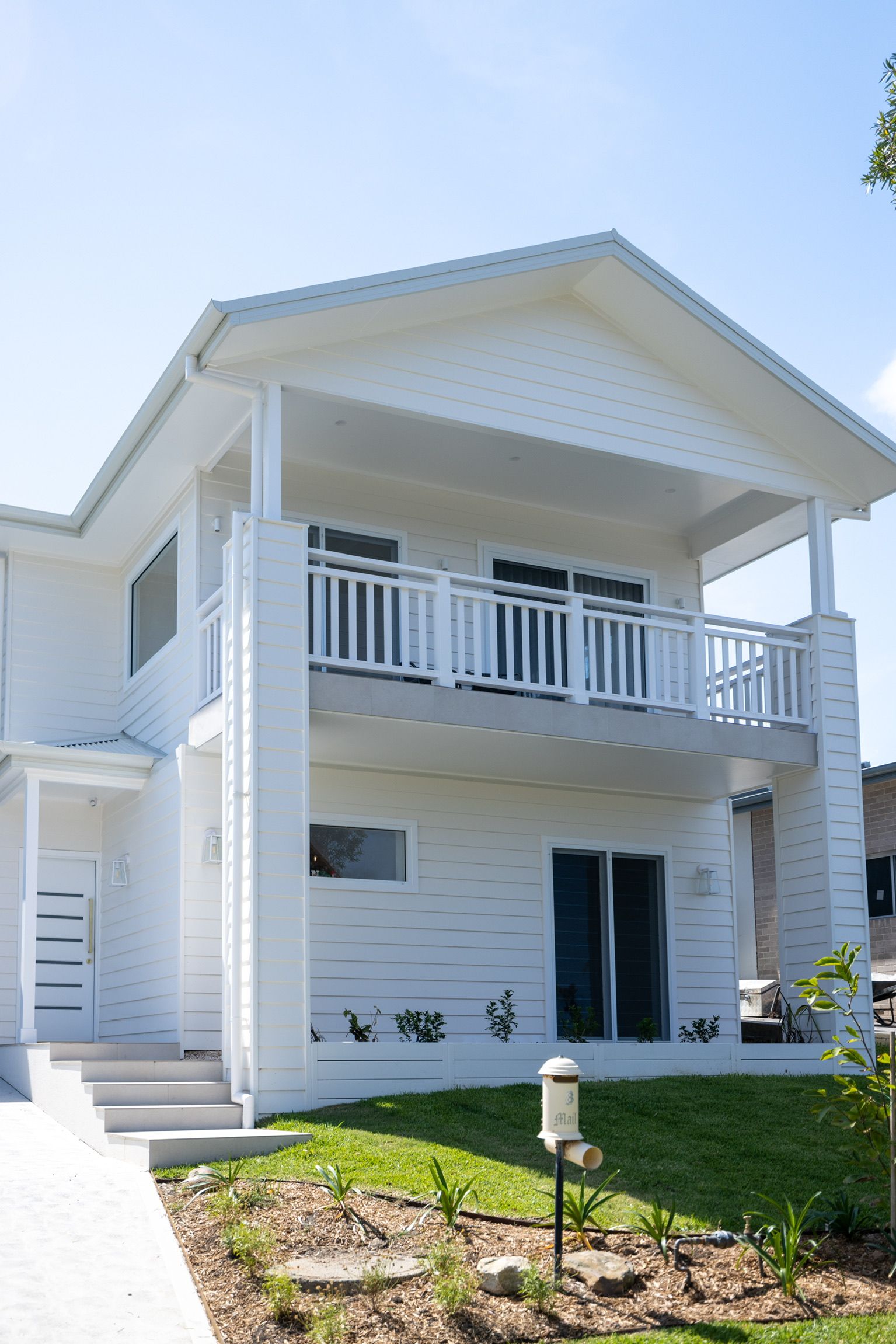 A House Is Being Built with Scaffolding Around It — Blue Horizon Projects in Bateau Bay, NSW
