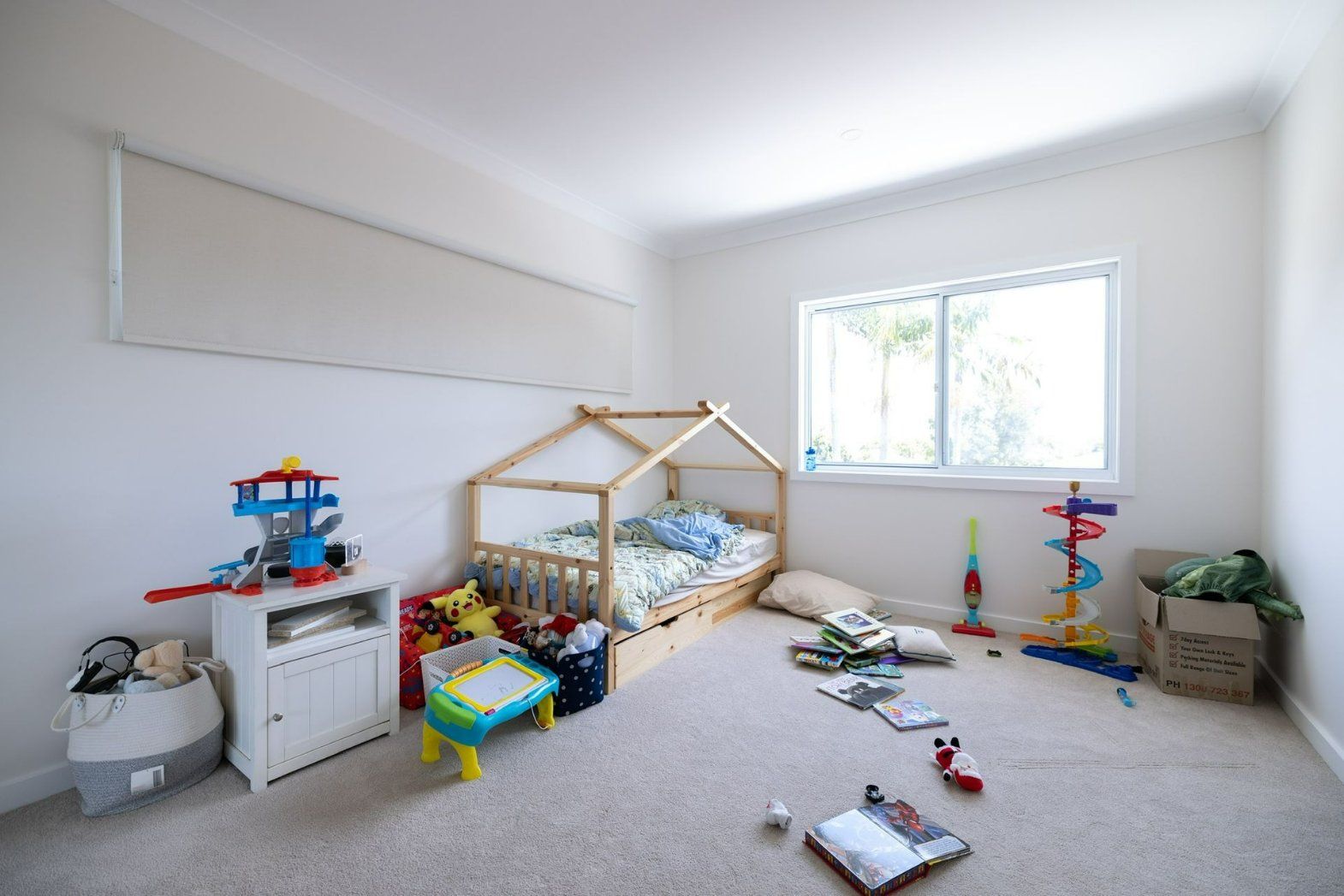 A Child 's Bedroom with A Bed, Toys, and A Window — Blue Horizon Projects in Berkeley Vale, NSW