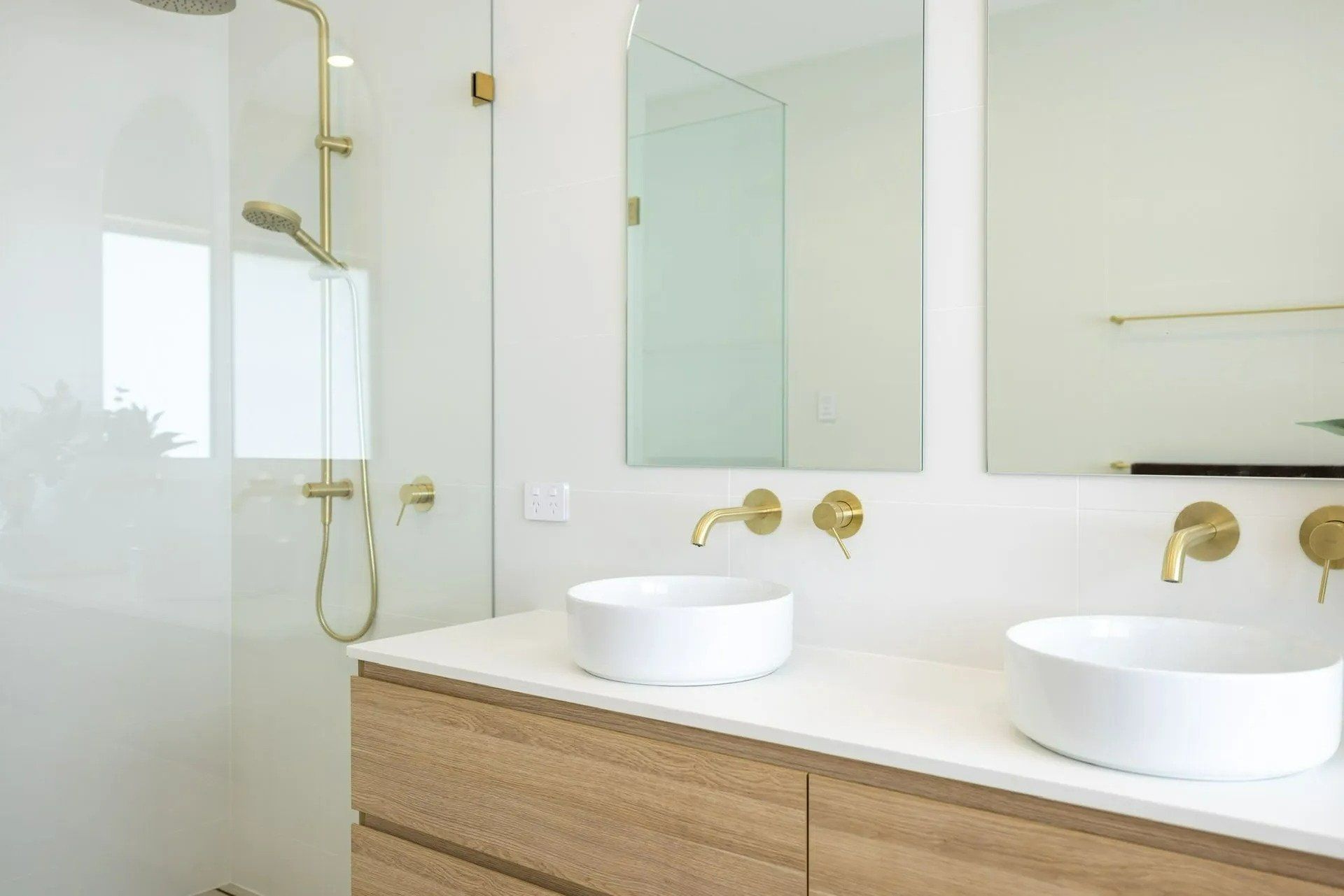 A Bathroom with Two Sinks, a Shower and A Mirror — Blue Horizon Projects in Hunter Valley, NSW
