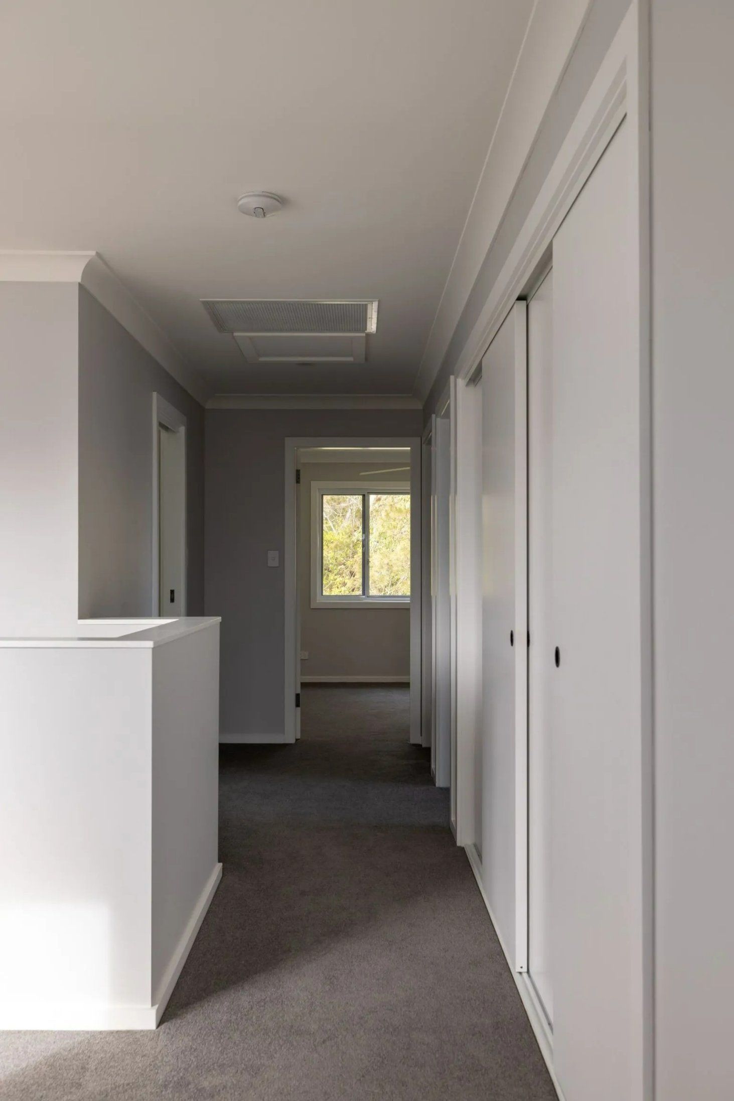 An Empty Hallway with A Staircase Leading to A Bedroom — Blue Horizon Projects in Hunter Valley, NSW