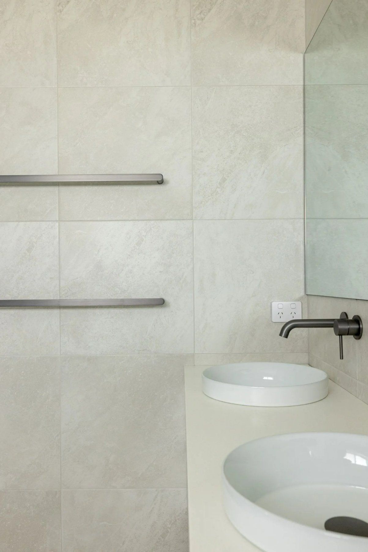 A Bathroom with Two Sinks and A Mirror — Blue Horizon Projects in Terrigal, NSW