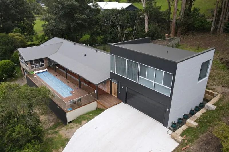 An Aerial View of A Modern House with A Swimming Pool — Blue Horizon Projects in Bateau Bay, NSW