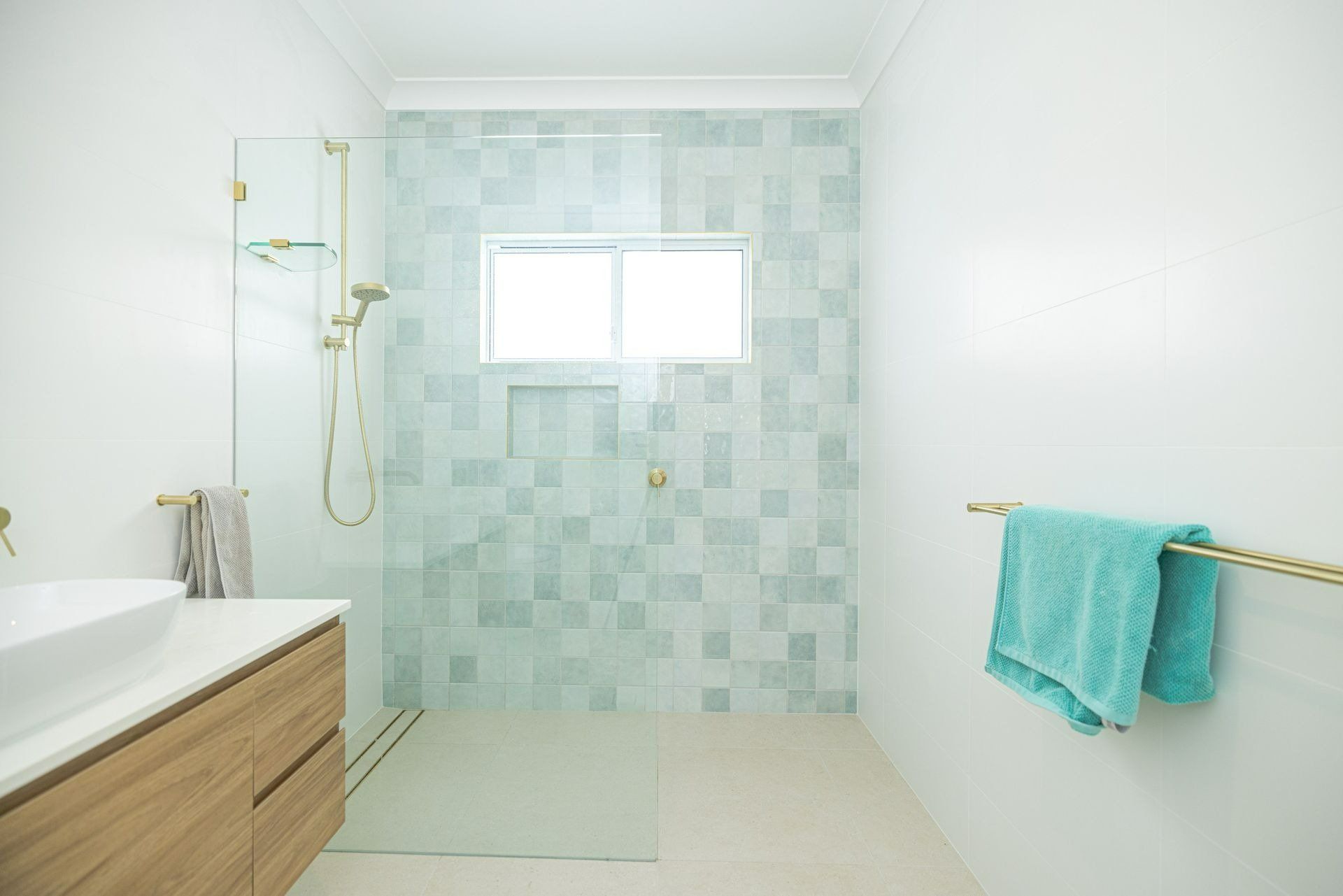 A Bathroom with A Walk in Shower , Sink , and Window — Blue Horizon Projects in North Avoca, NSW