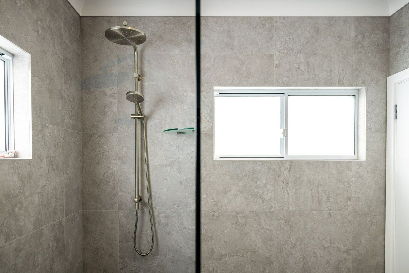 A Bathroom with A Walk in Shower and A Window — Blue Horizon Projects in North Avoca, NSW