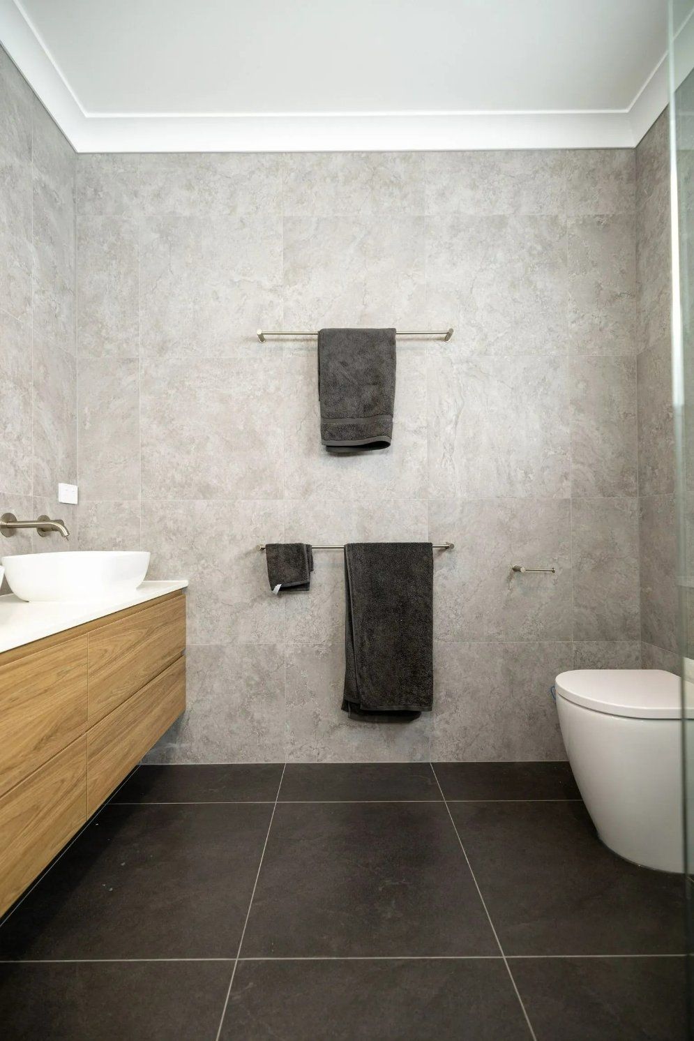 A Bathroom with A Toilet, Sink, and Towel Rack — Blue Horizon Projects in North Avoca, NSW