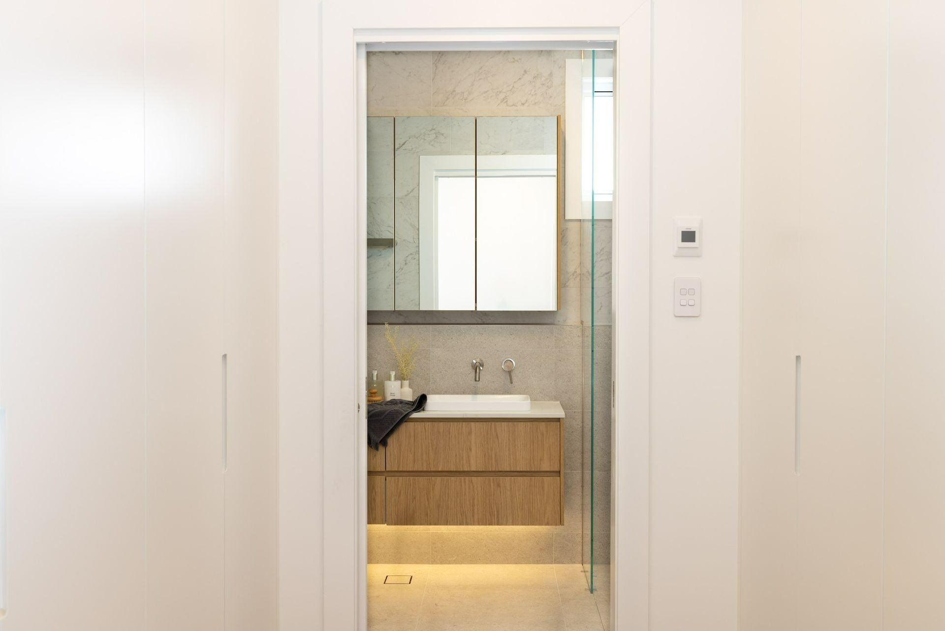 A Bathroom with A Sink, Mirror and Walk in Shower — Blue Horizon Projects in Tumbi Umbi, NSW