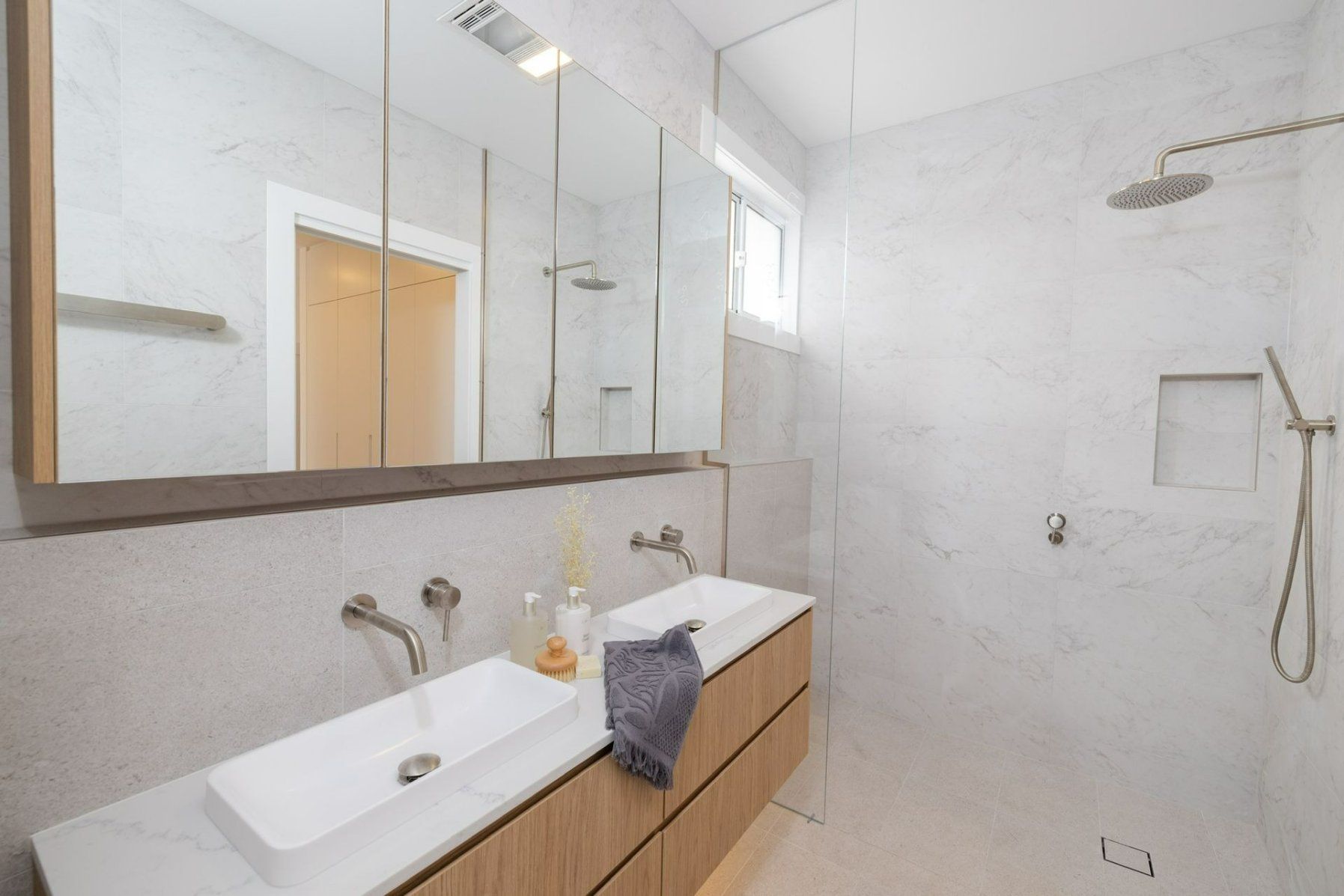 A Bathroom with Two Sinks and A Walk in Shower — Blue Horizon Projects in Tumbi Umbi, NSW