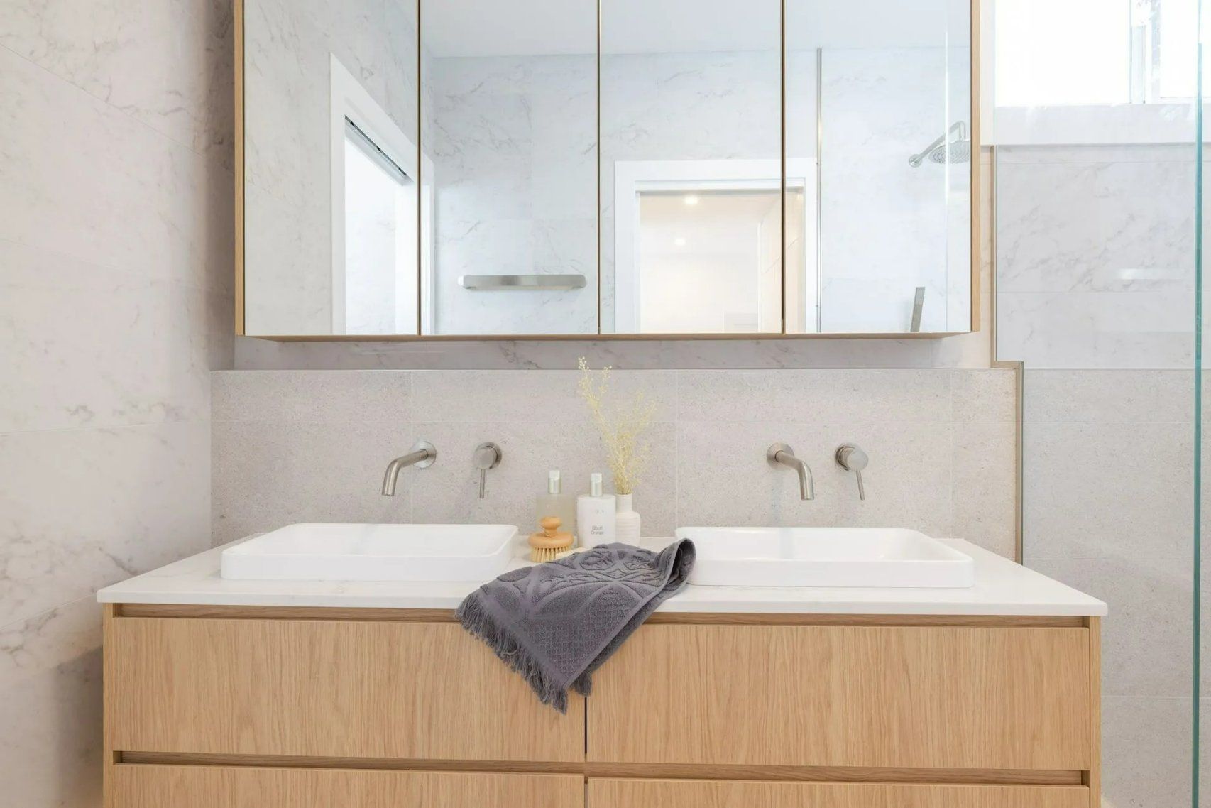A Bathroom with Two Sinks and A Mirror — Blue Horizon Projects in Wyong, NSW