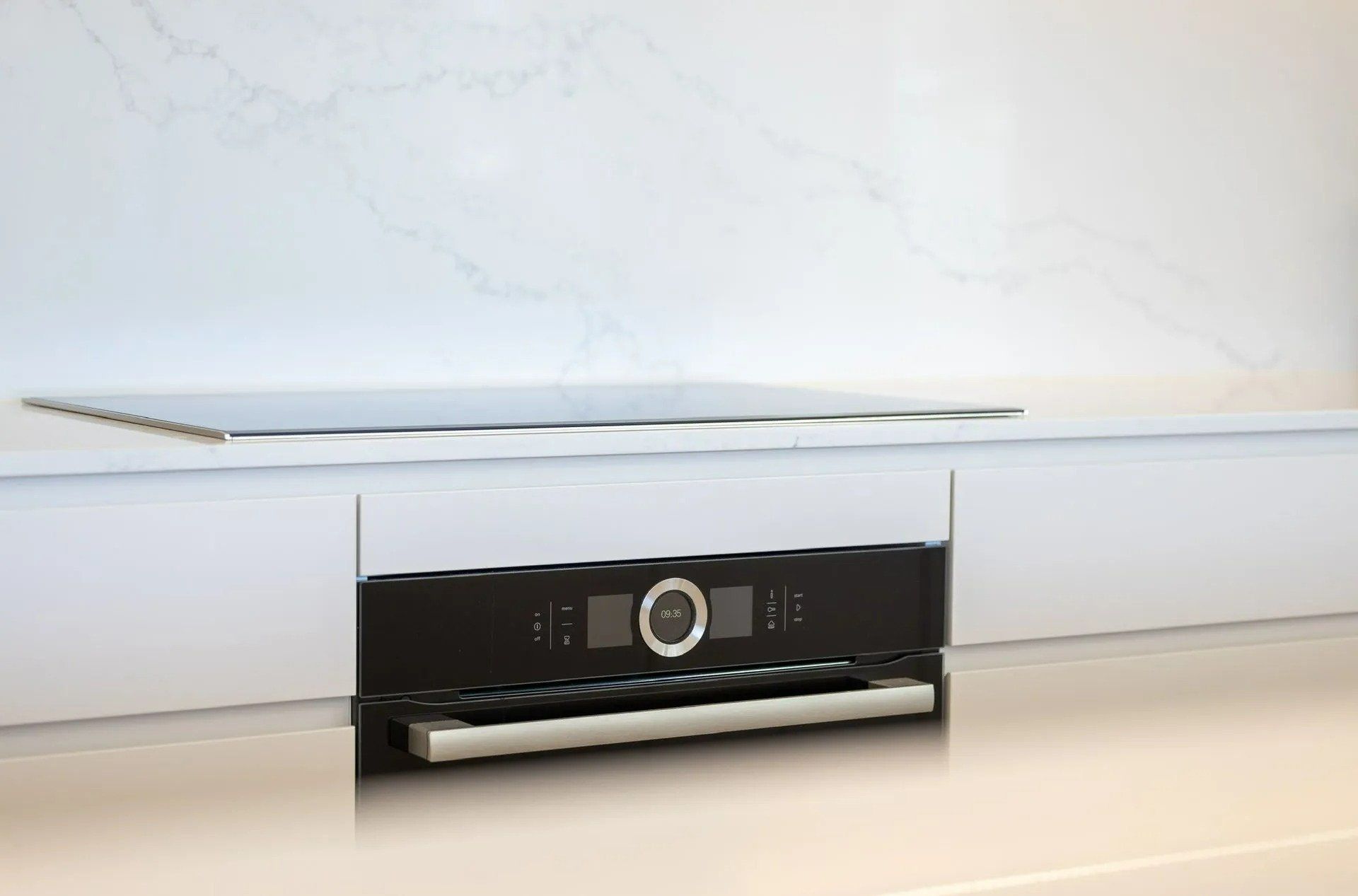 A Stove Top Oven Is Sitting on A Counter in A Kitchen — Blue Horizon Projects in Shelly Beach, NSW