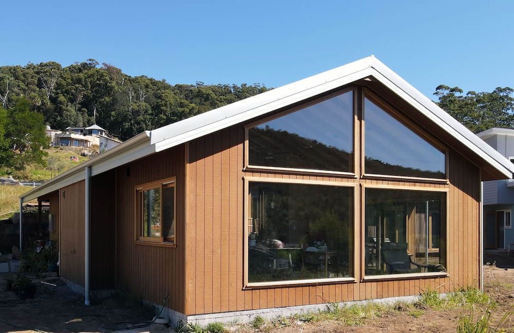 Modern Wooden House with Large Windows — Blue Horizon Projects in Bateau Bay, NSW 