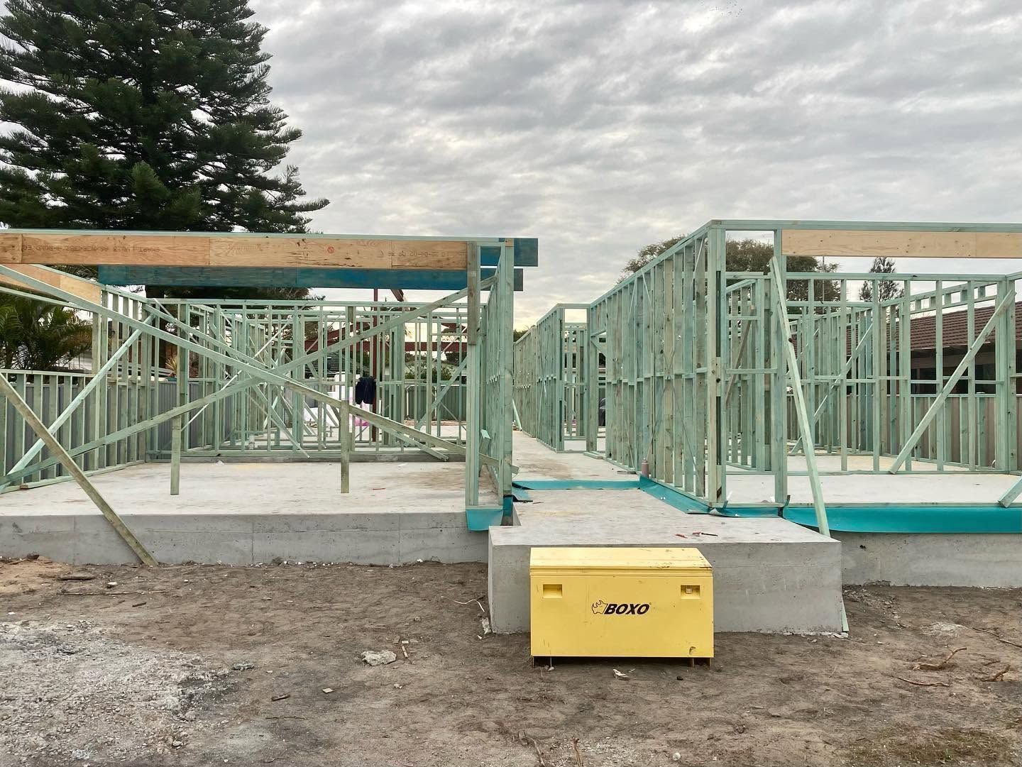 Partially Built House Frame With Green Lumber — Blue Horizon Projects in Berkeley Vale, NSW