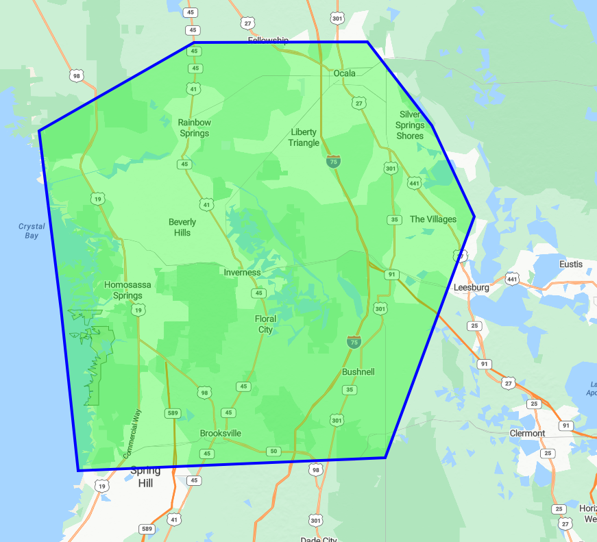 Blue-outlined green polygon over a map, marking a route area near a lake and roads