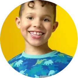Smiling boy with healthy teeth on yellow background