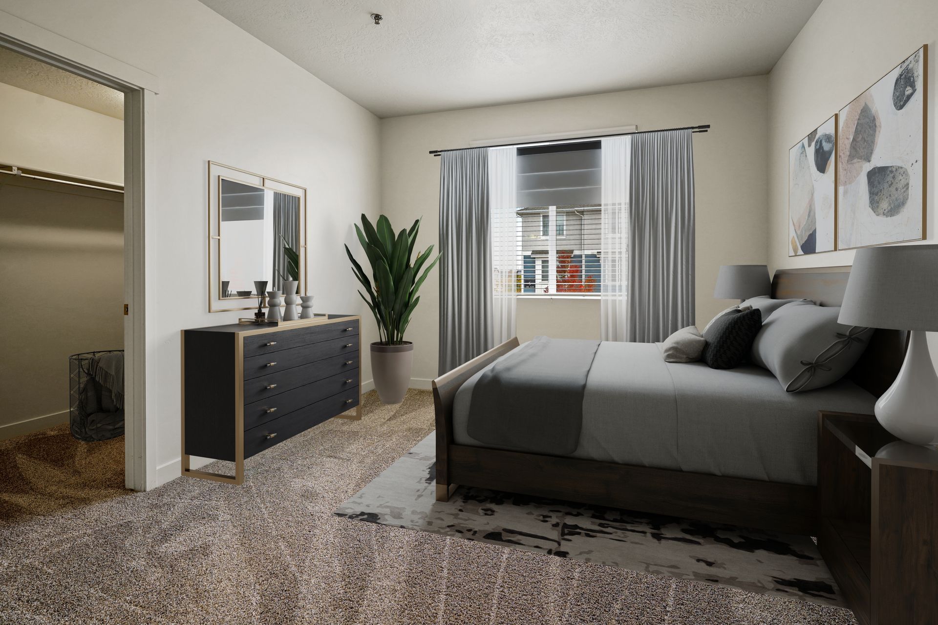 a bedroom with a bed , dresser , mirror and a walk in closet .