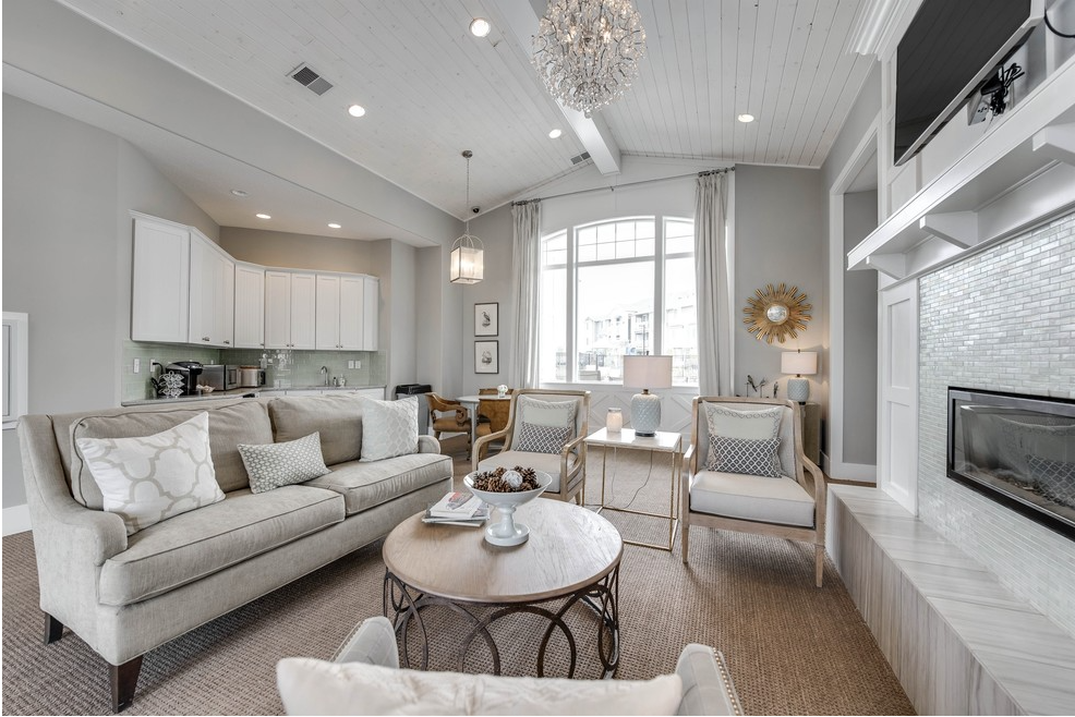 a living room filled with furniture and a fireplace .