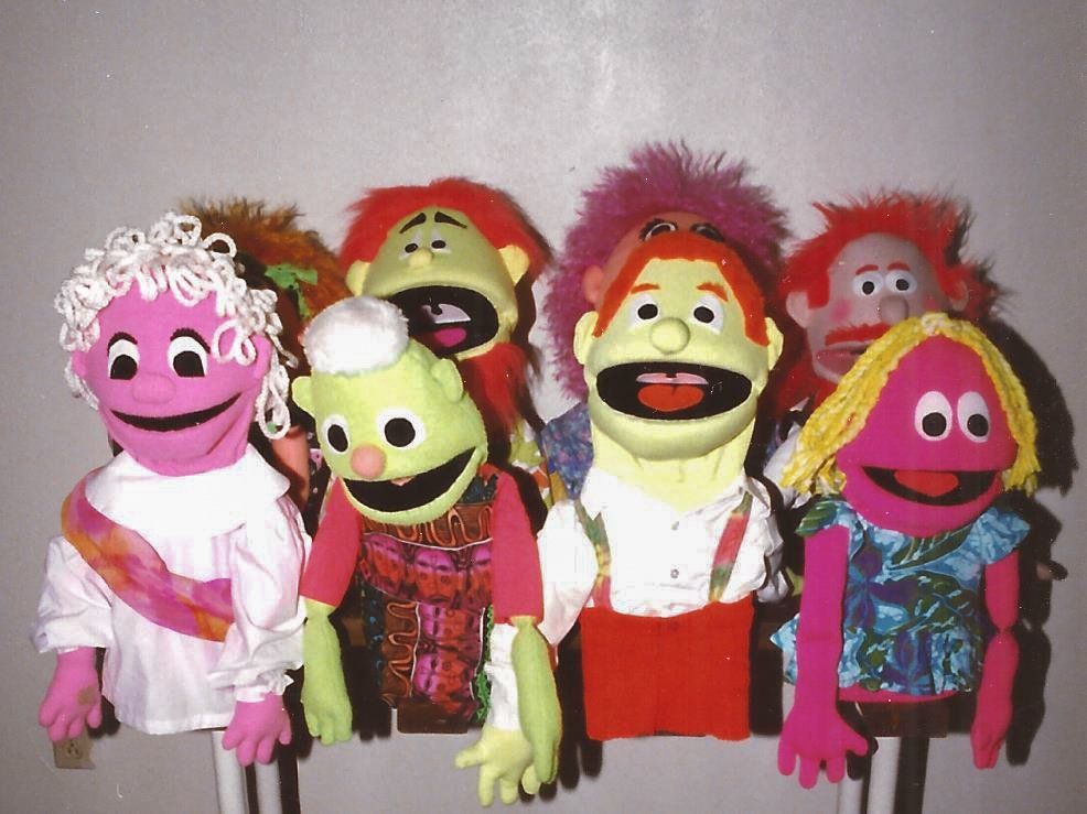 A collect of human moving mouth puppets designed with blacklight fabric