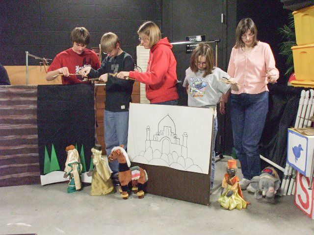 marionette team manipulating their puppets