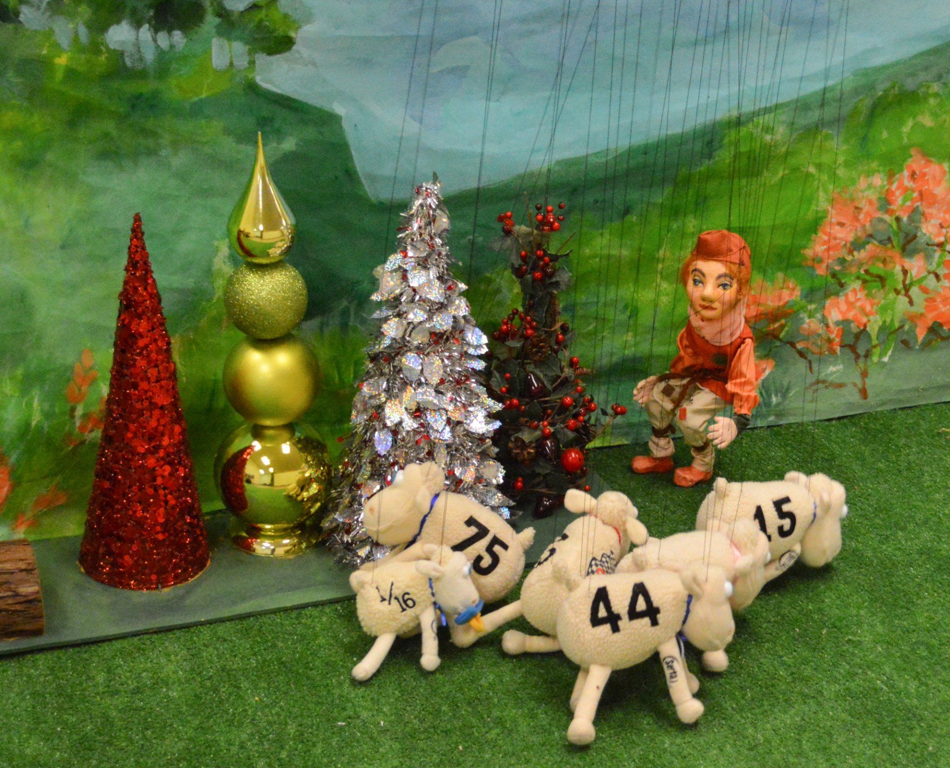 Little boy puppet about to be stampeded by a flock of sheep