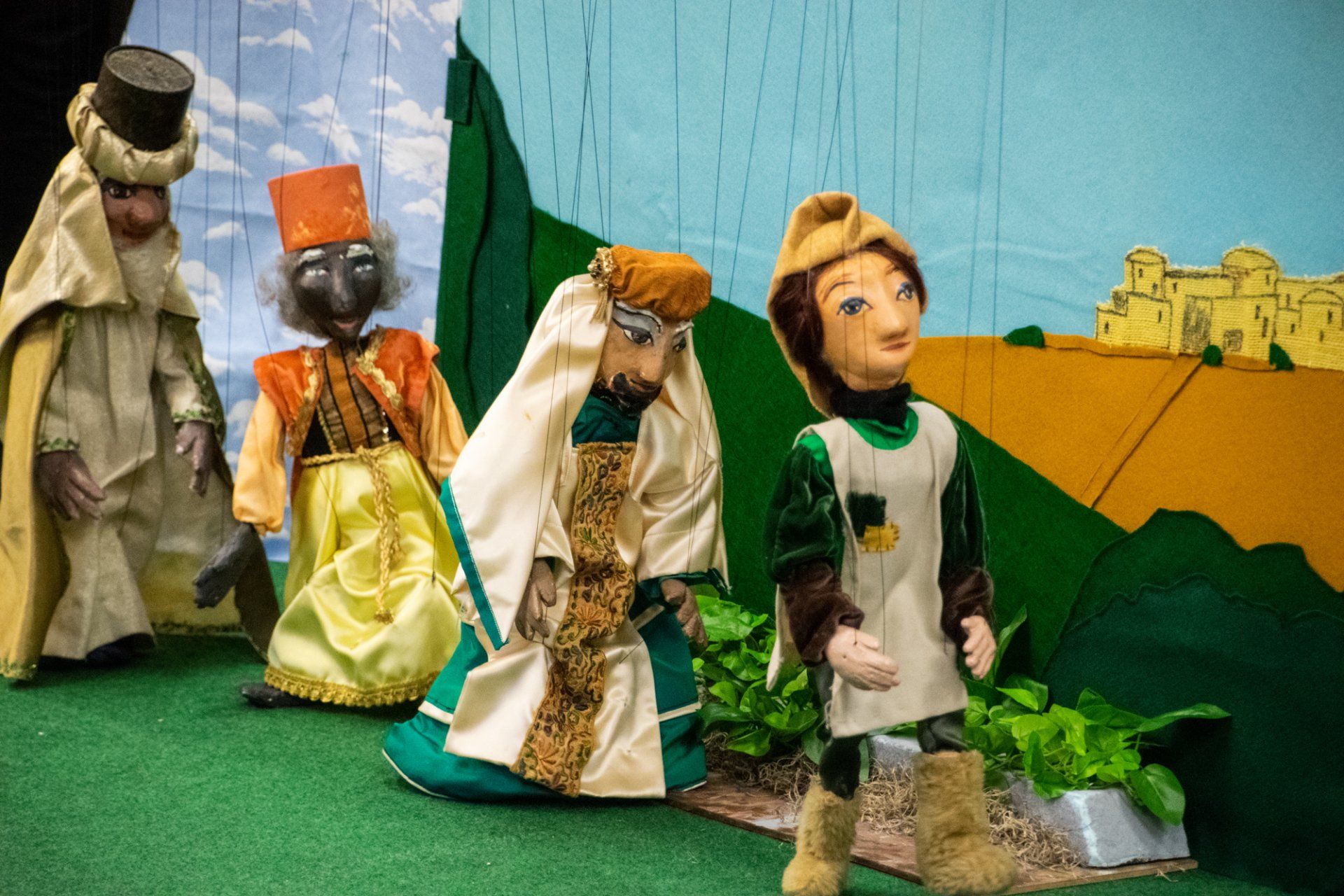Photo of four marionettes  in field