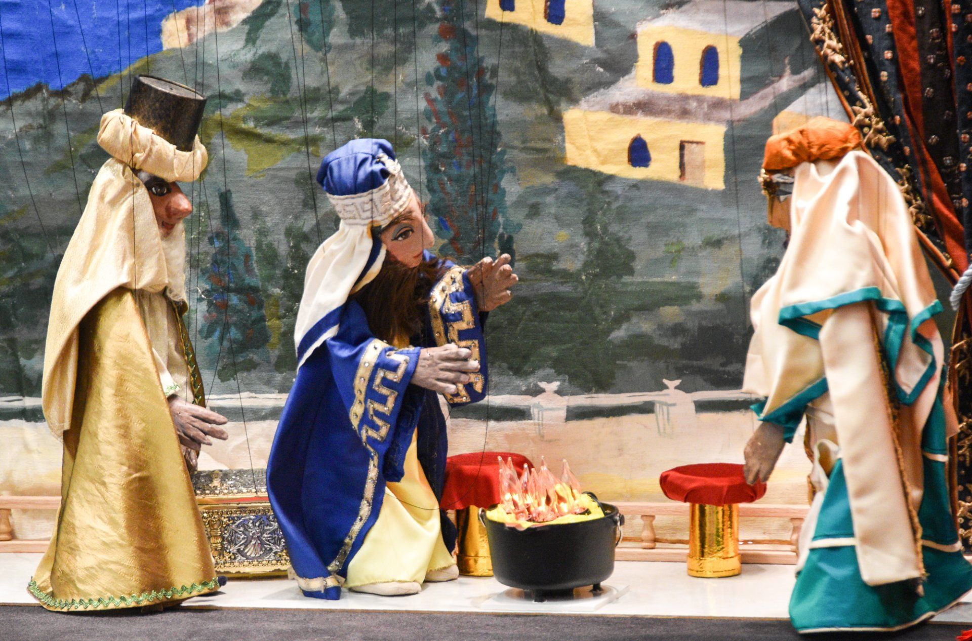 Artaban character is speaking to the Wisemen with the fire in the foreground