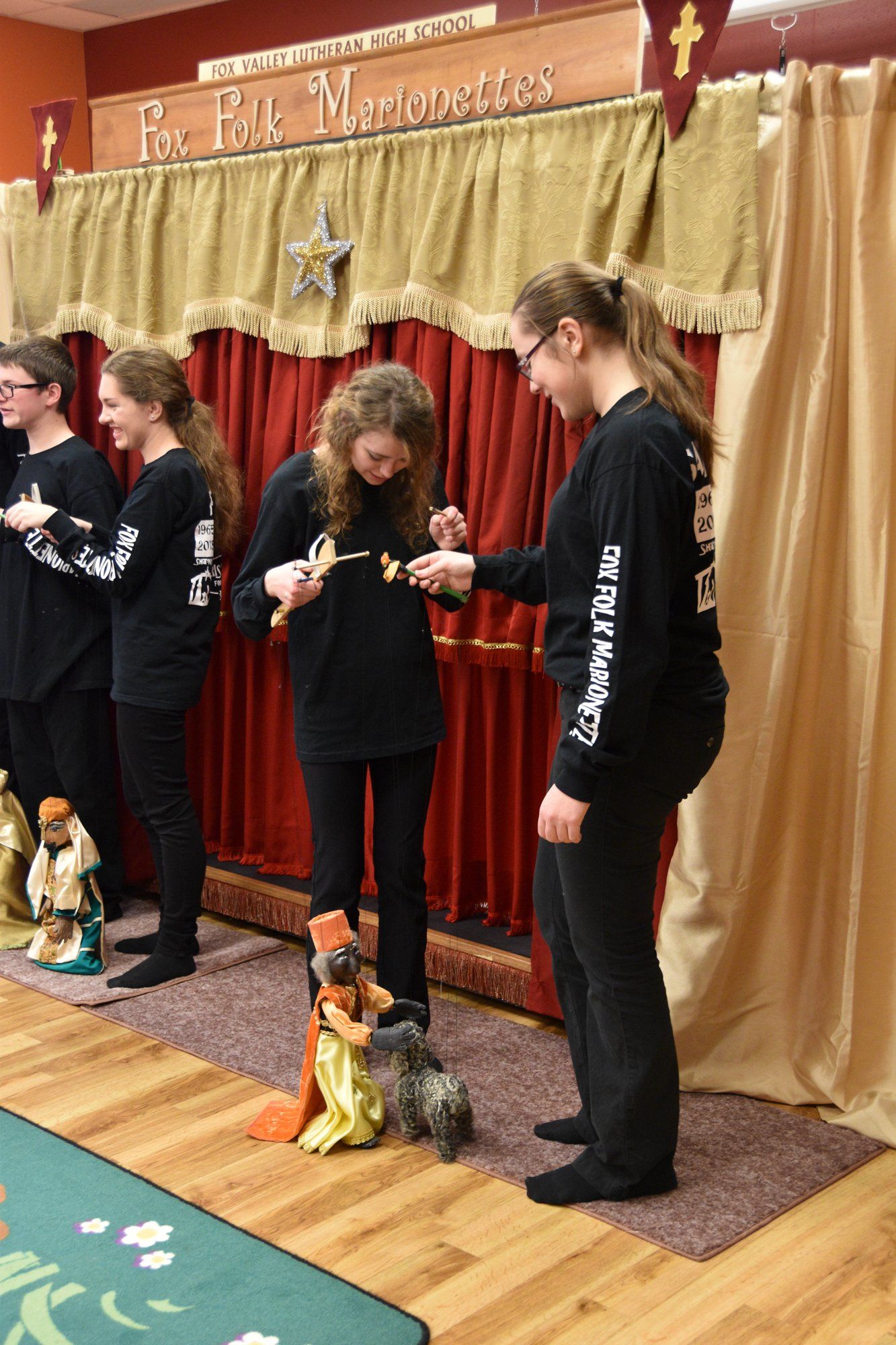 Puppeteers bring out the marionettes for audeience demonstration after the show