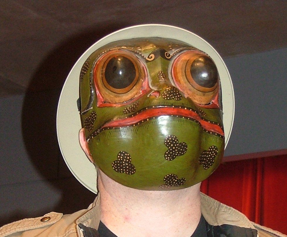 Mr. Dave models and authentic African frog mask puppet