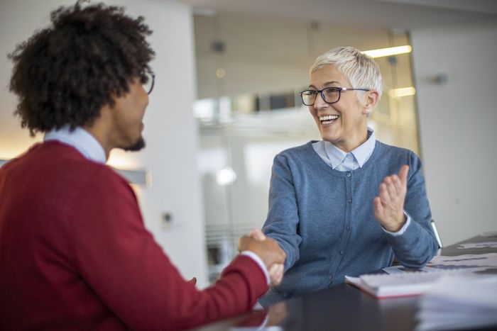 Woman And Young Businessman Handshaking — Sunrise, FL — CEI Staffing