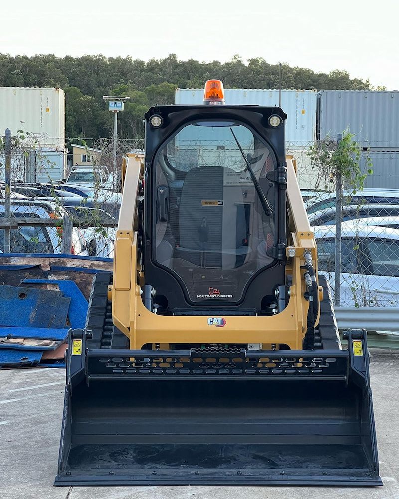 A Bulldozer is Parked in a Parking Lot — Norcoast Diggers in Ballina, NSW