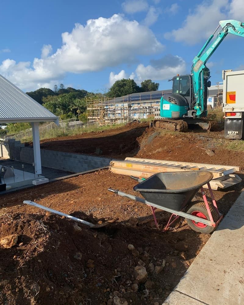 A Construction Site With a Wheelbarrow and Shovel in the Dirt — Norcoast Diggers in Lismore, NSW