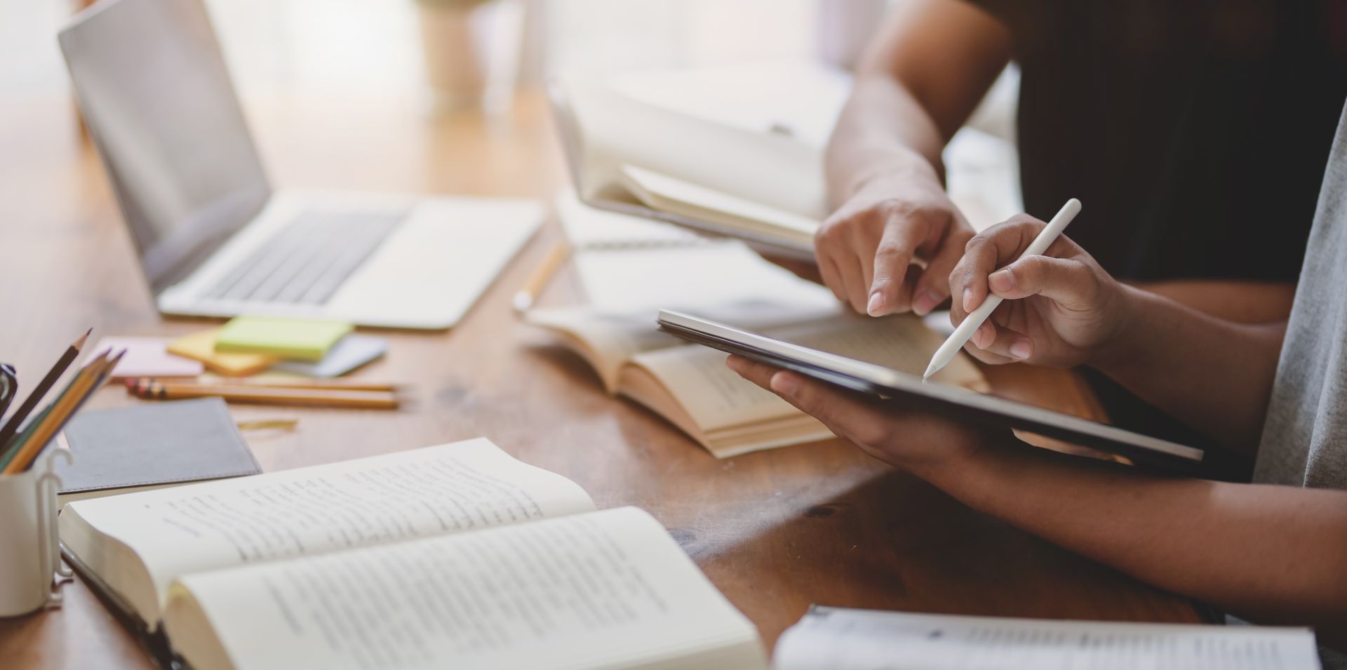 table with books and tablet 