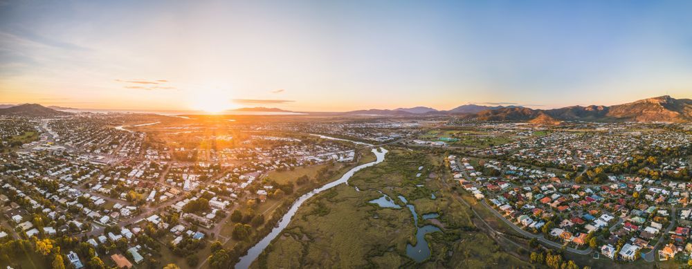 An Aerial View Of A City And A River At Sunset — Law Air Conditioning In Townsville, QLD