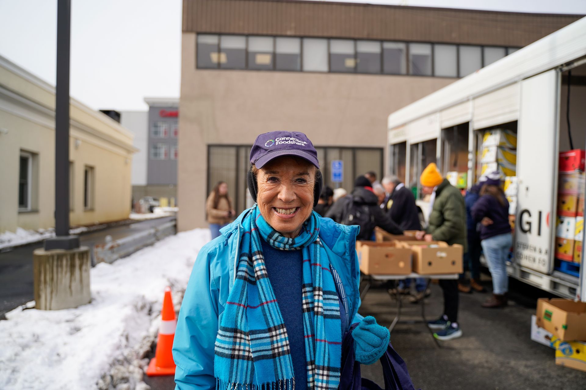 Connecticut Foodshare board member, Arlene, helps set up the newest mobile food pantry in Fairfield County.