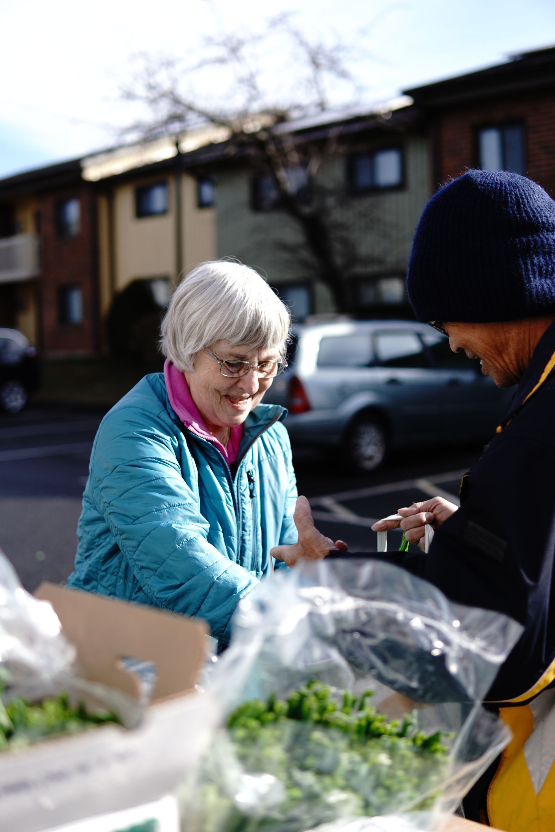 Molly's Aunt Maureen, helping guests at the mobile food pantry in Manchester's Squire Village.
