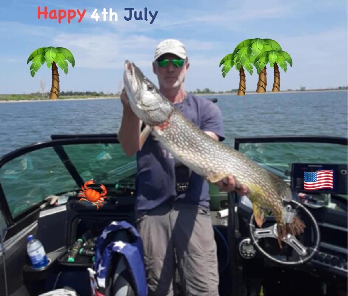 Man on boat holding large fish, Happy 4th of July, palm trees, American flag.