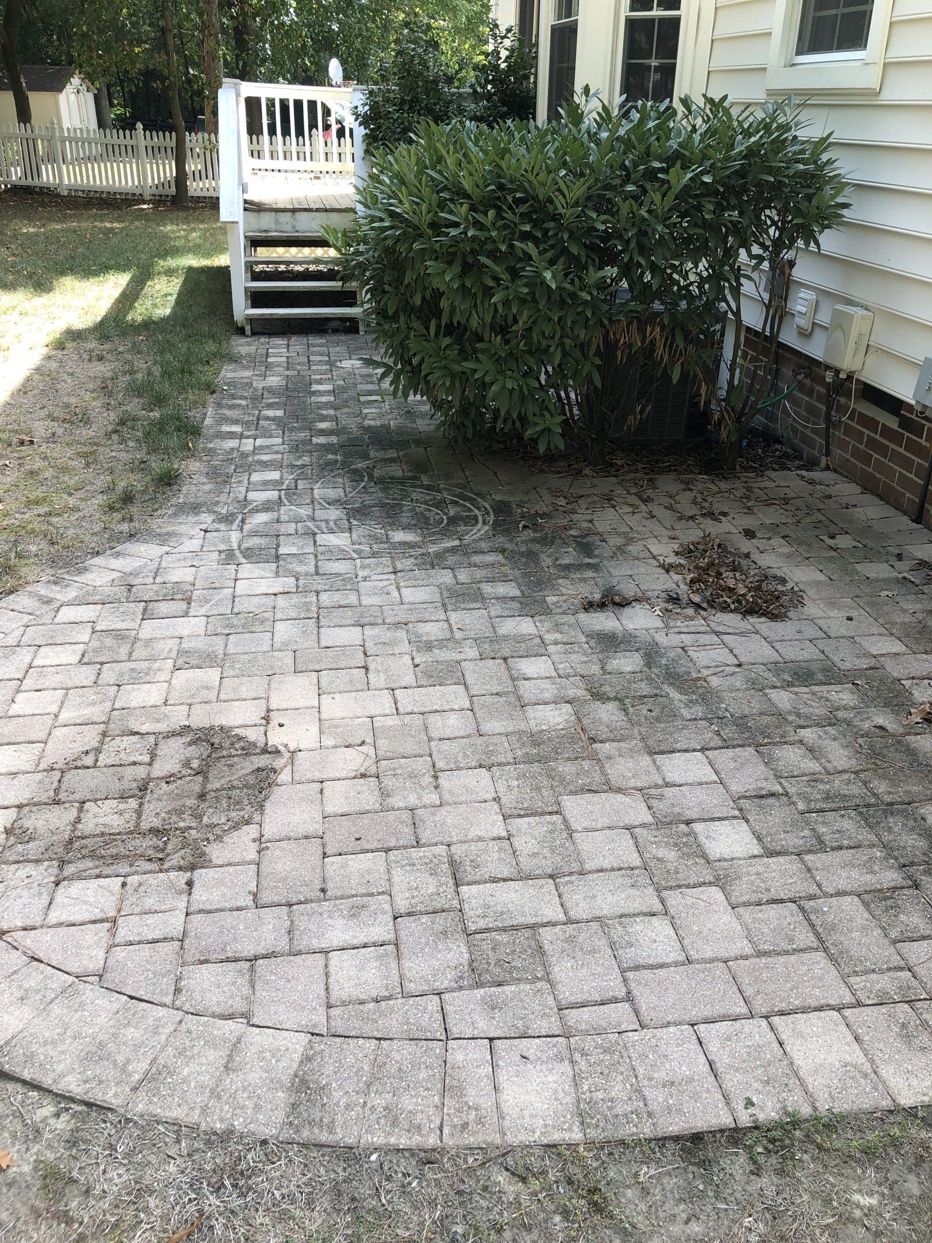old dirty concrete path way to house with grass