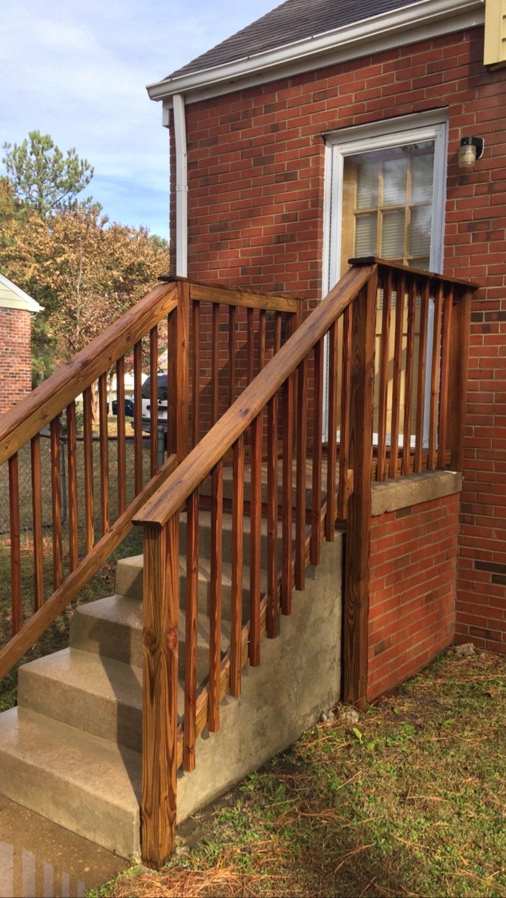 cleaned new look old wood stairs with a bricks wall