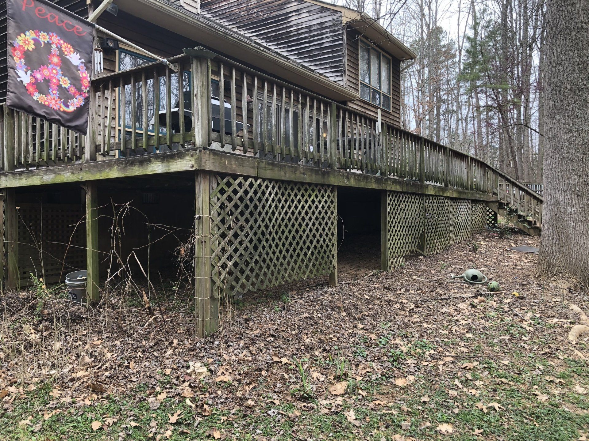 dirty old wood deck, house and windows