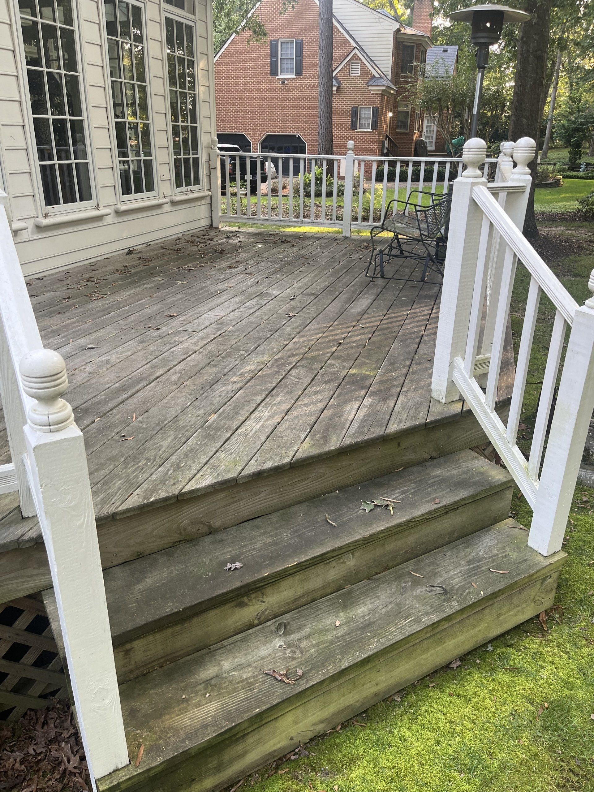 old wooden balcony with white stairs