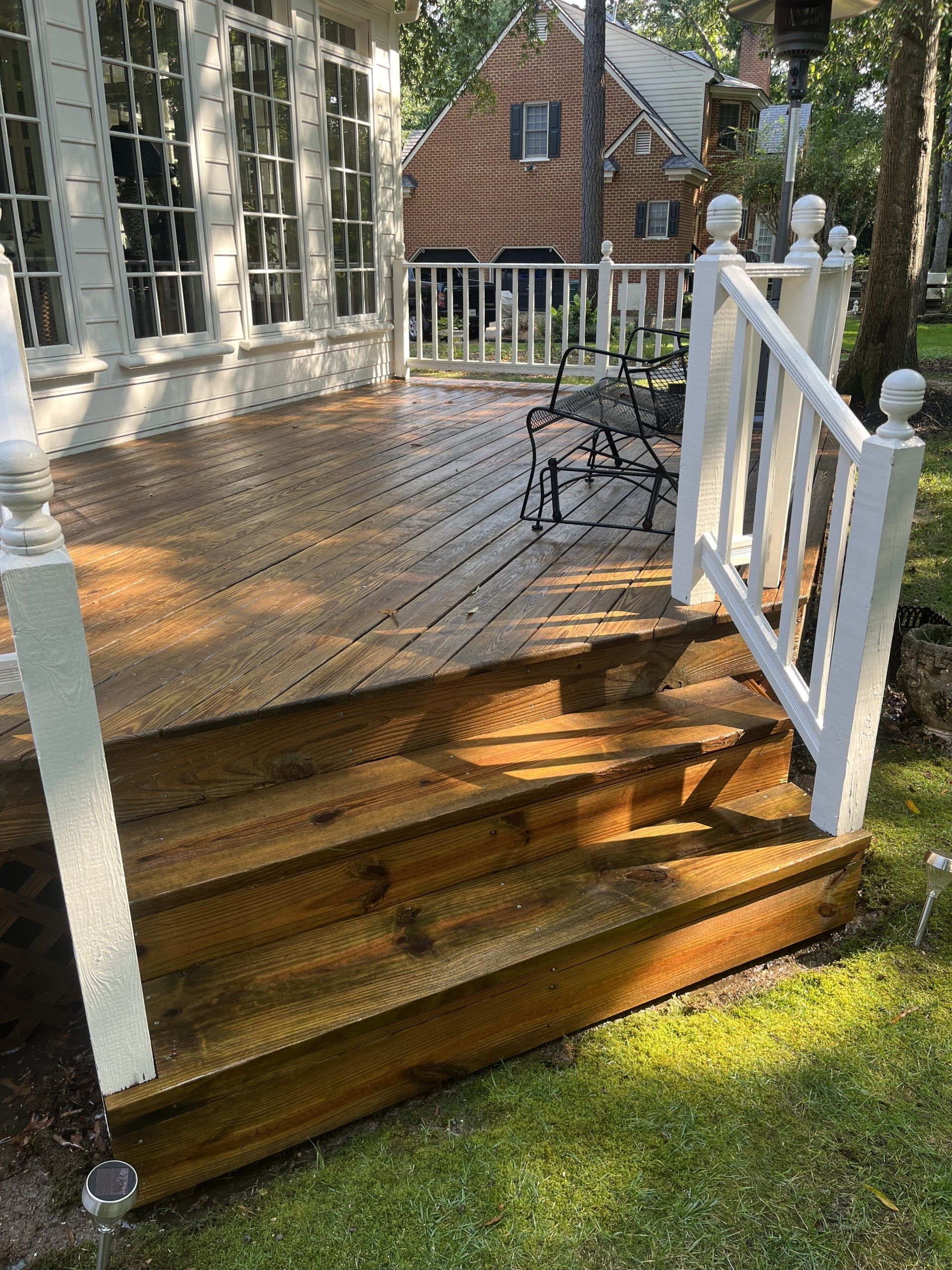 cleaned new look old wooden balcony with white stairs