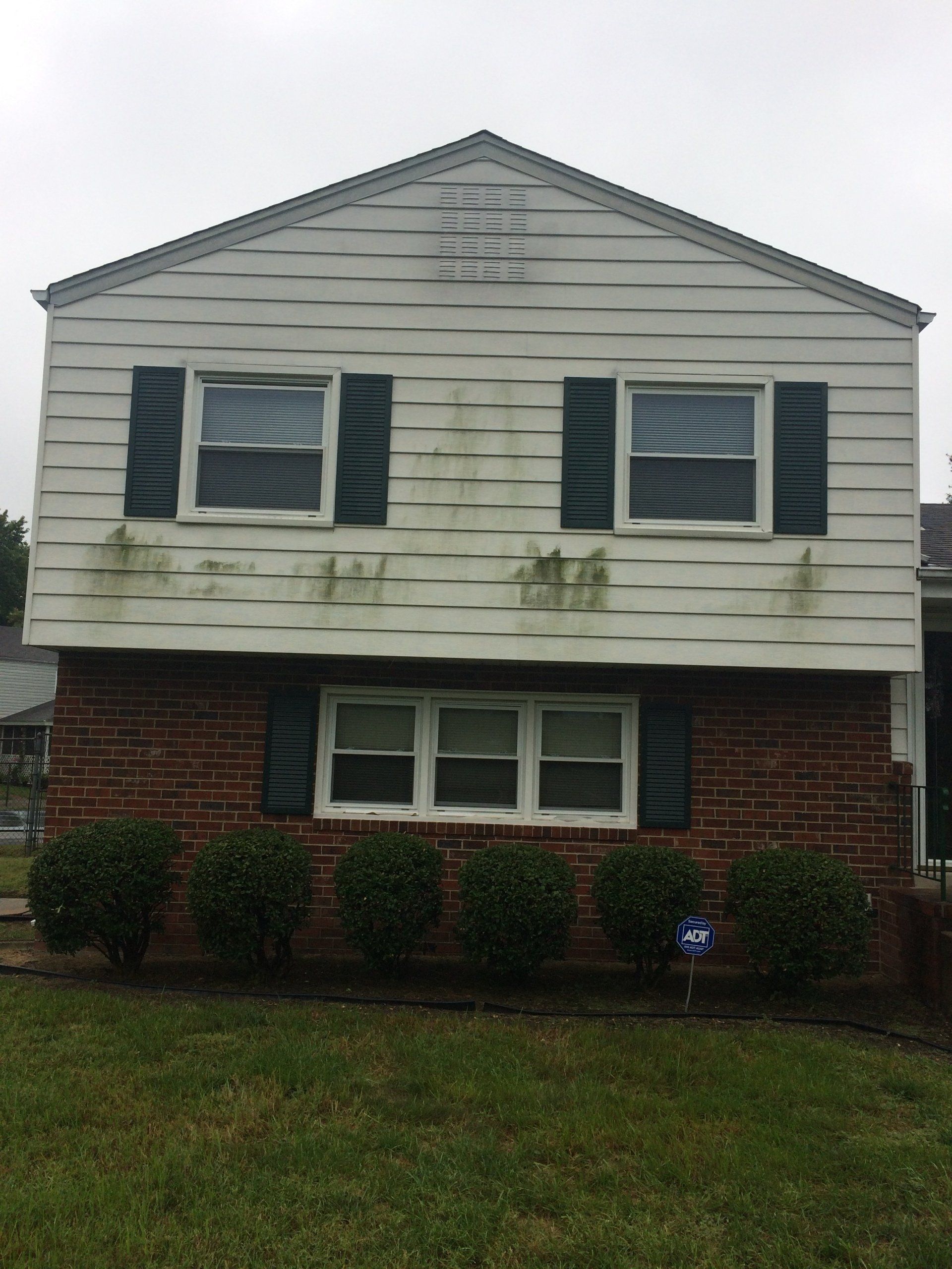 dirty white and bricks house exterior