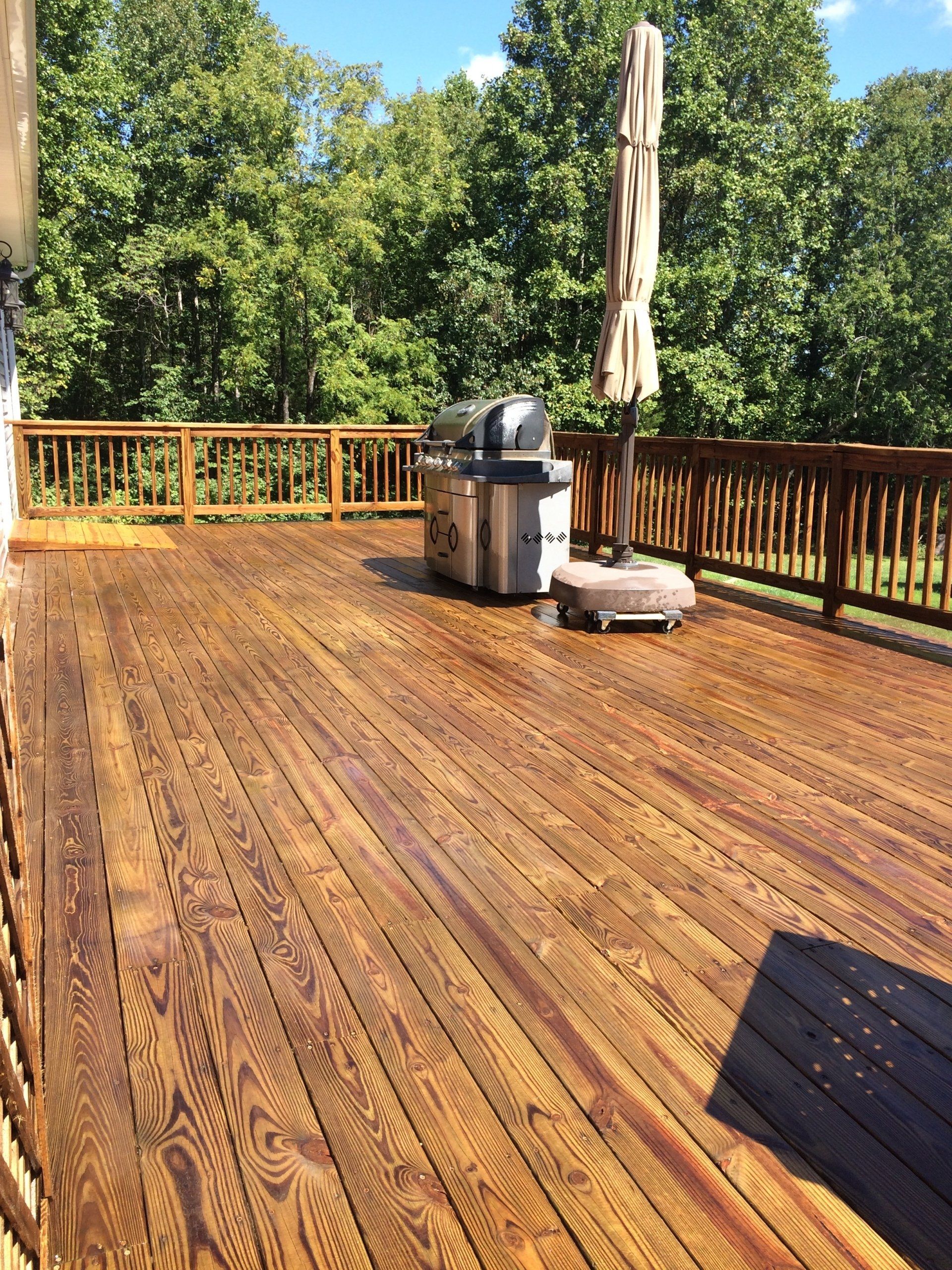 cleaned new look old terrace with umbrella and grill