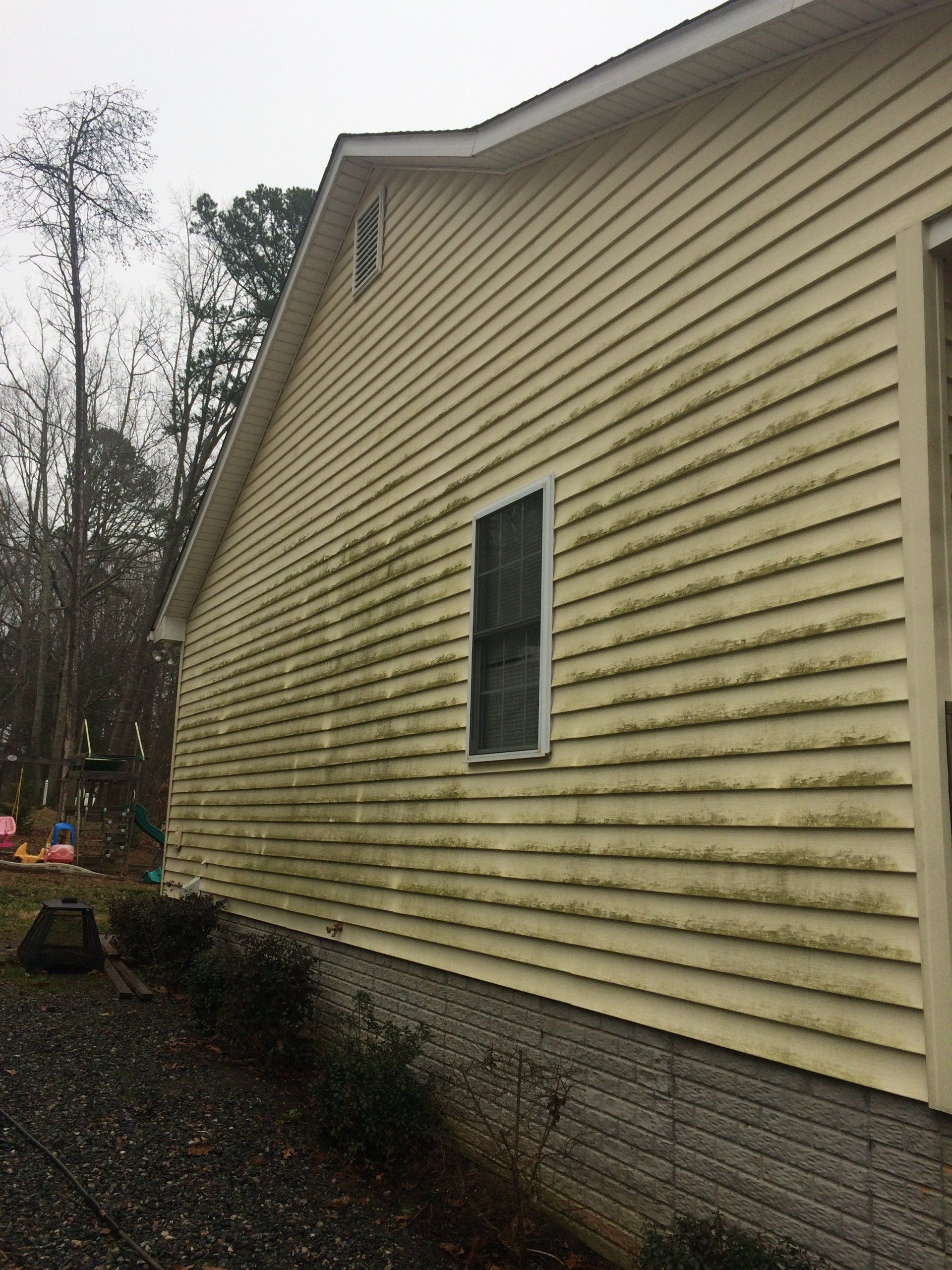 dirty sand color exterior house with one vertical window