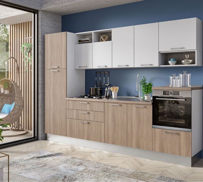 Modern kitchen with wood lower cabinets, white upper cabinets, black appliances, and a large window.
