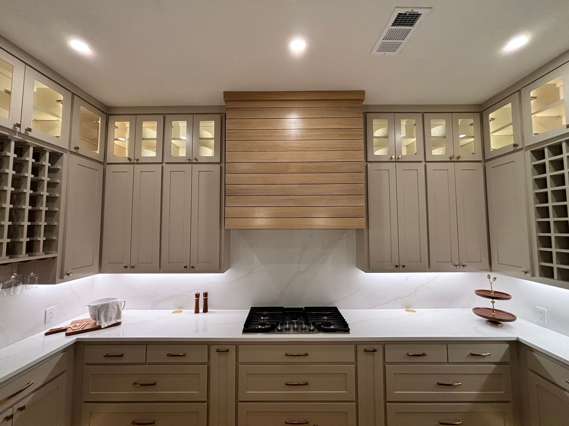 Veteran-owned cabinet makers Arlington TX — craftsman examining cabinet joinery in workshop
