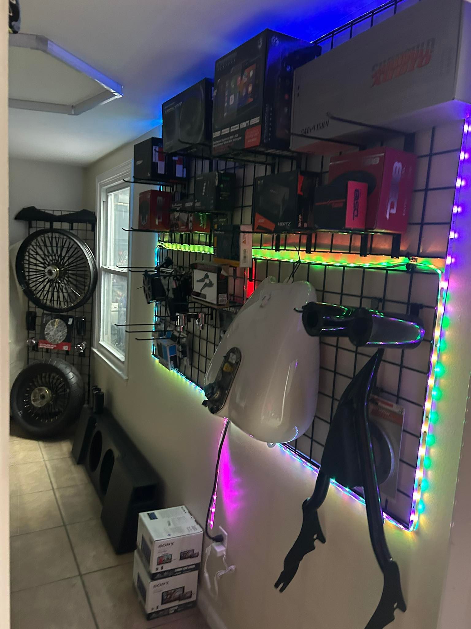 Car audio shop interior with displays of car parts and electronics.