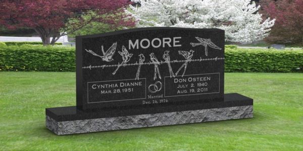 A black gravestone with the name moore on it