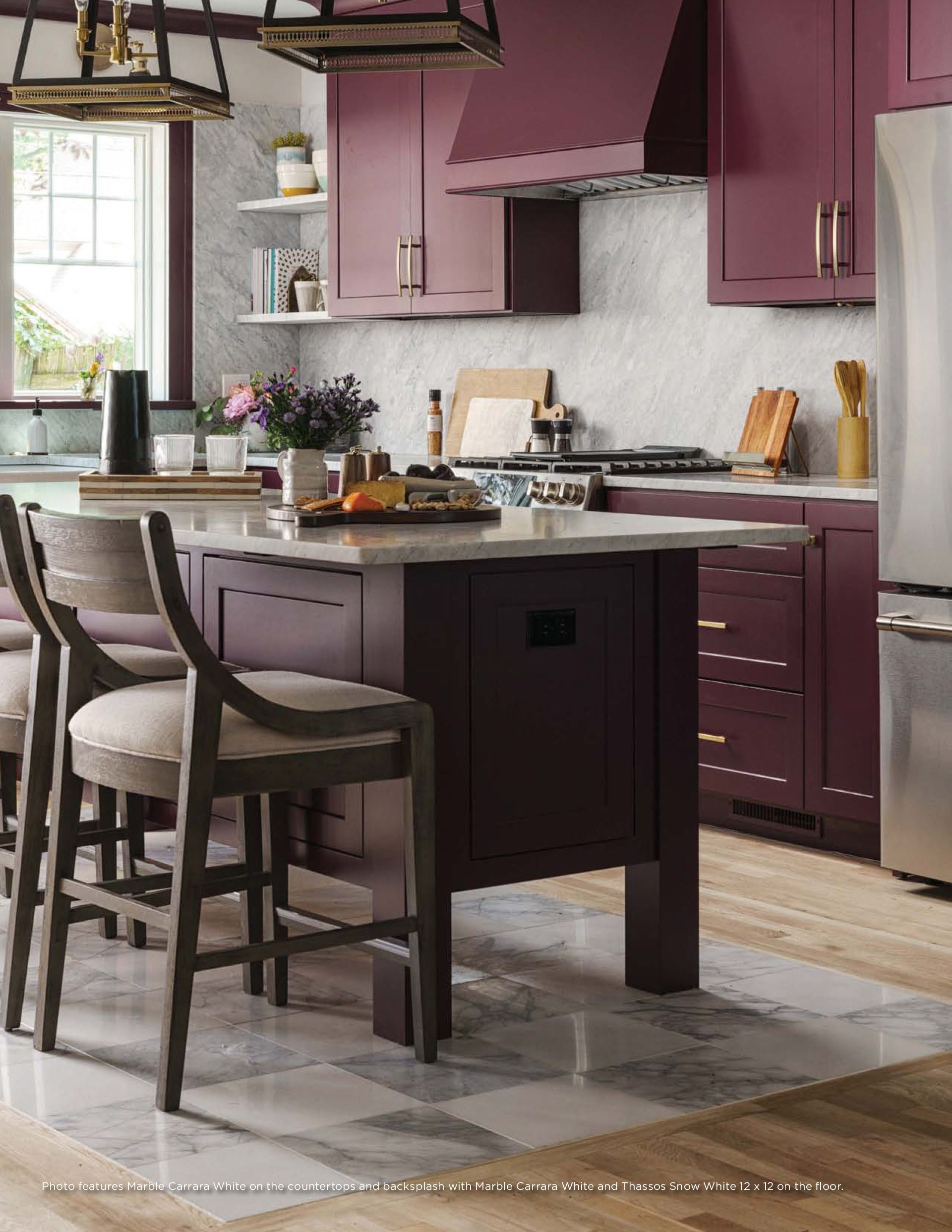 Kitchen remodel | A kitchen with purple cabinets , stainless steel appliances , and a large island.